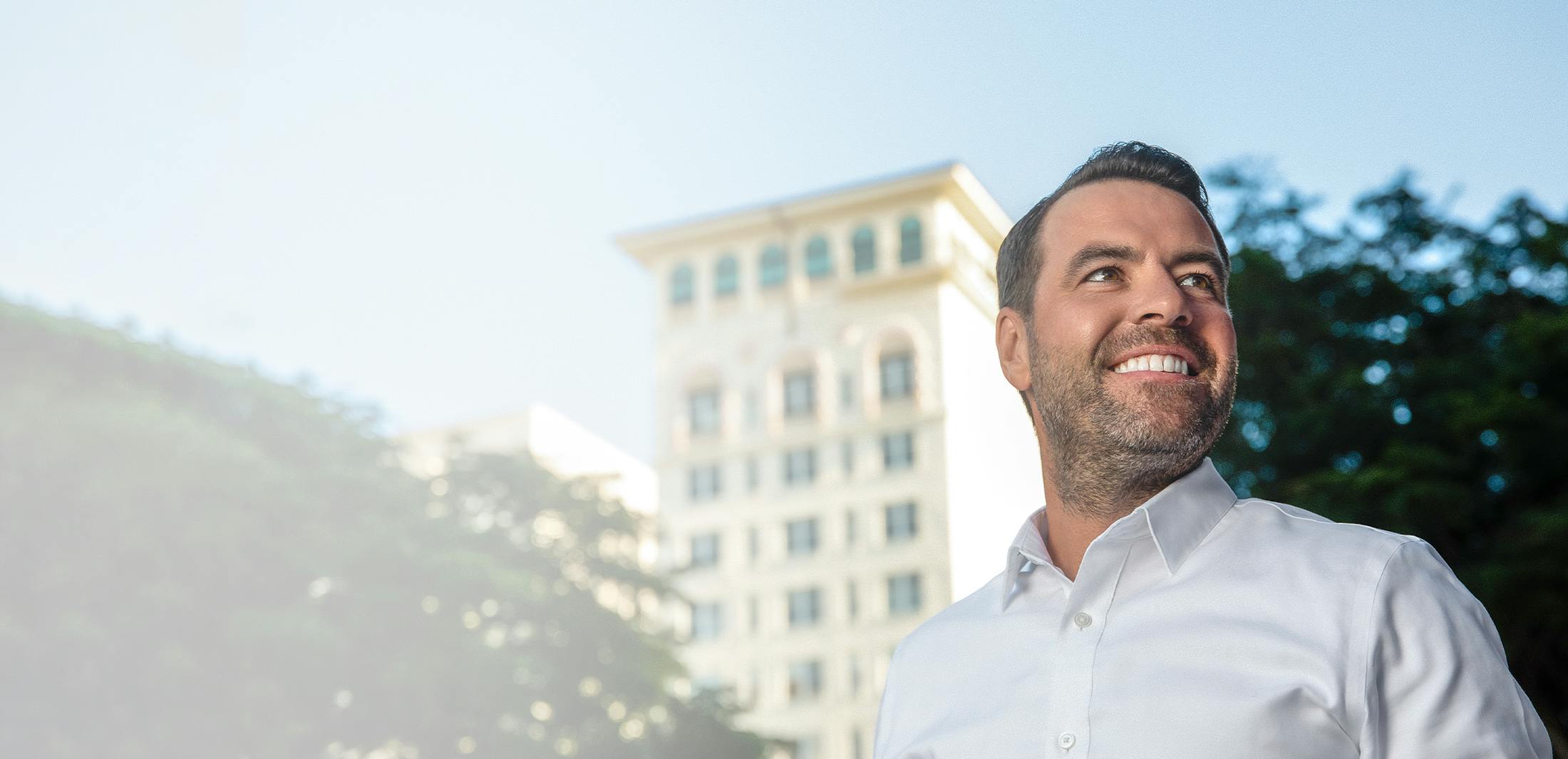 man with a building in the background