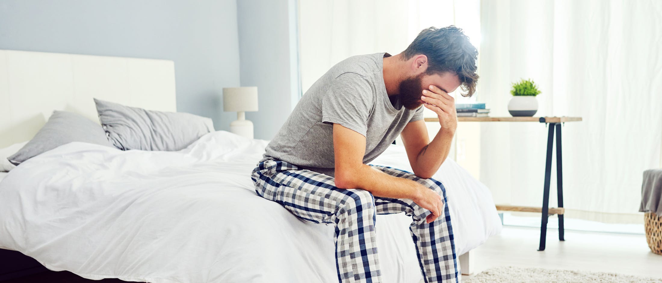 Man sitting on bed