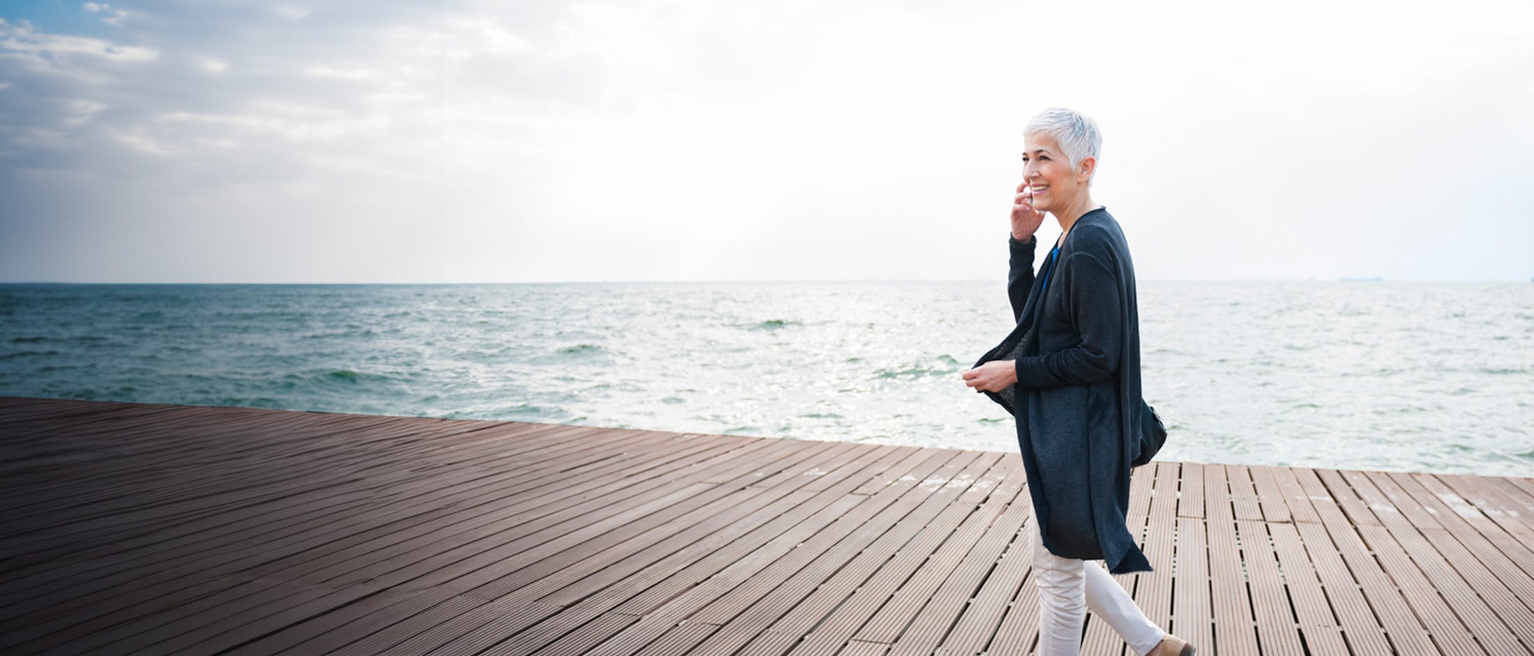 Woman walking on a boardwalk