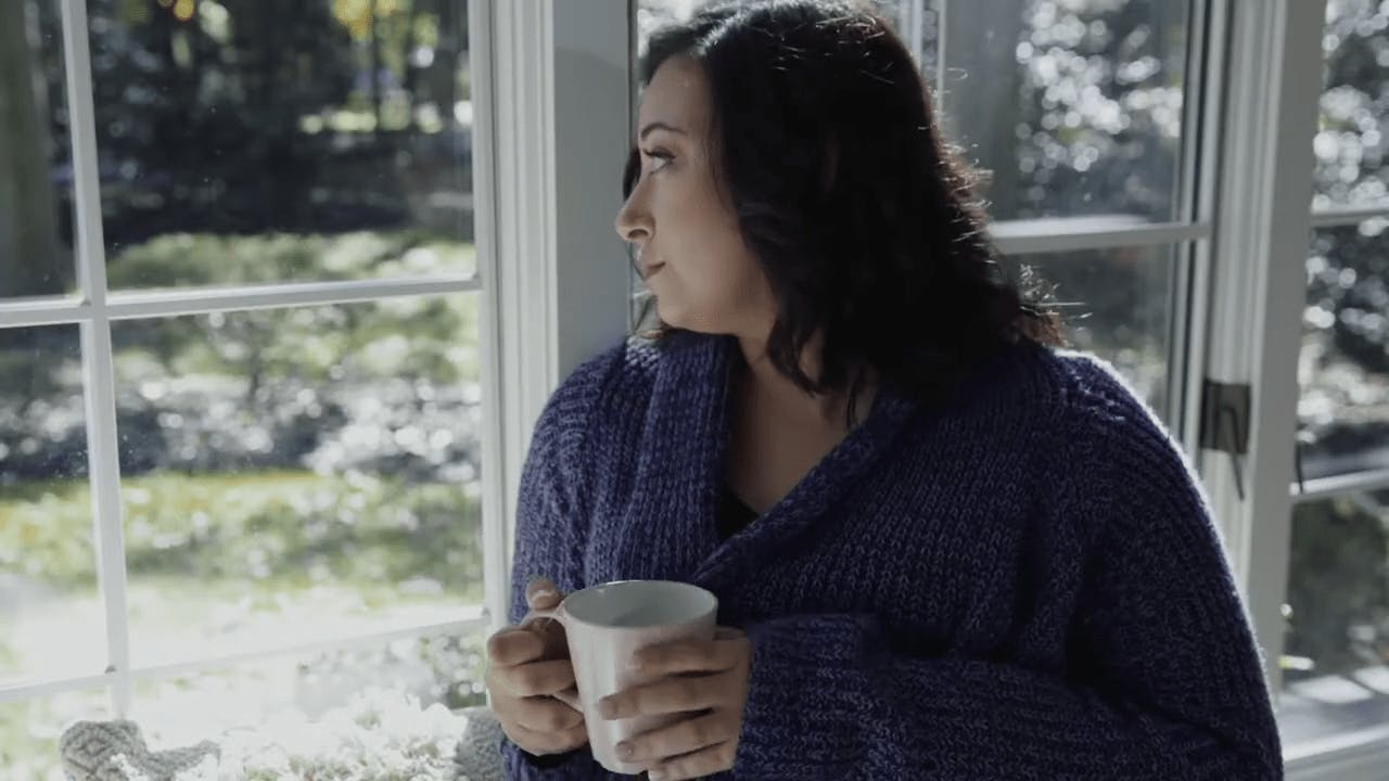 Woman with cup of coffee