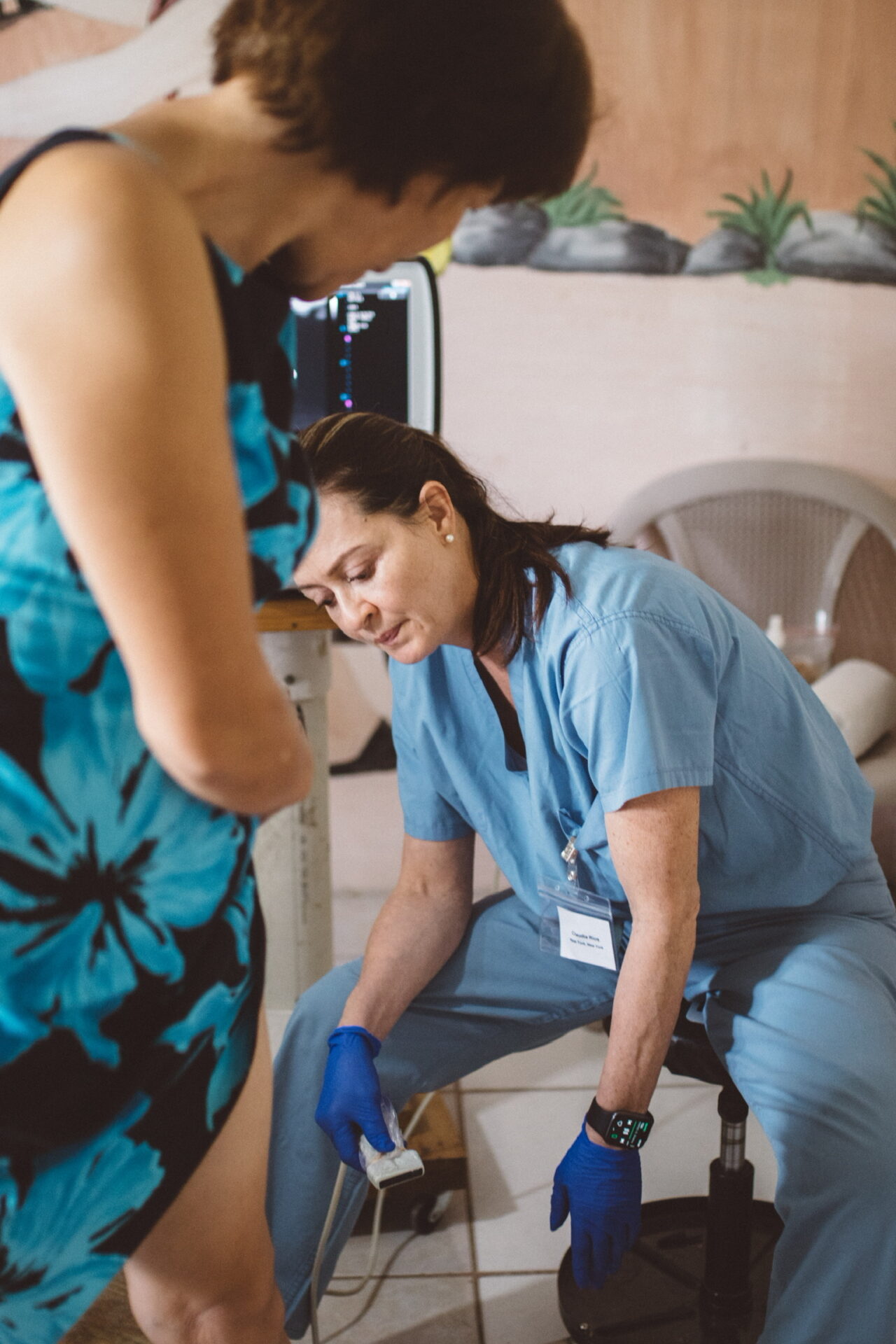 Woman receiving vein treatment