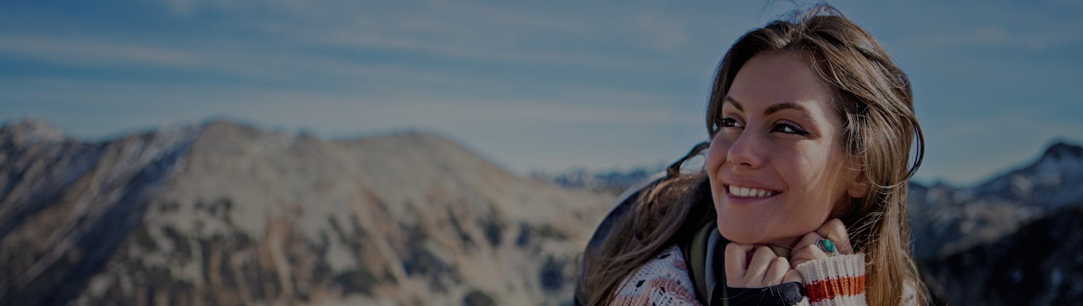 Woman in the mountains smiling