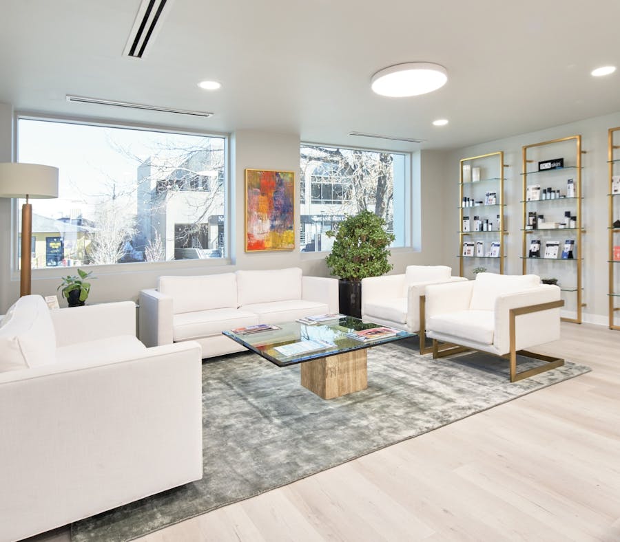 Denver Facial Plastics waiting room view from bottom of stairs.