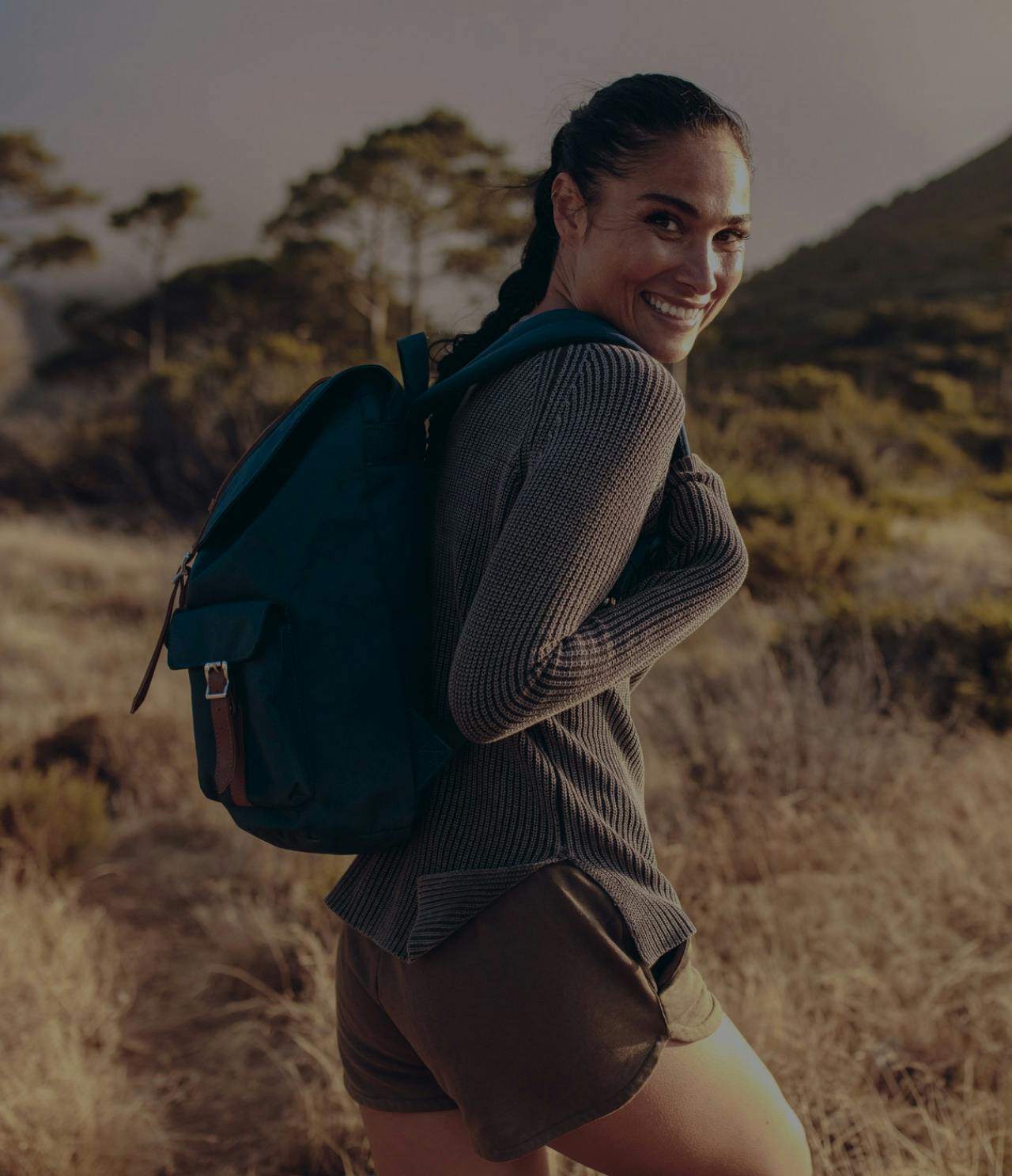 Sporty woman outside hiking.