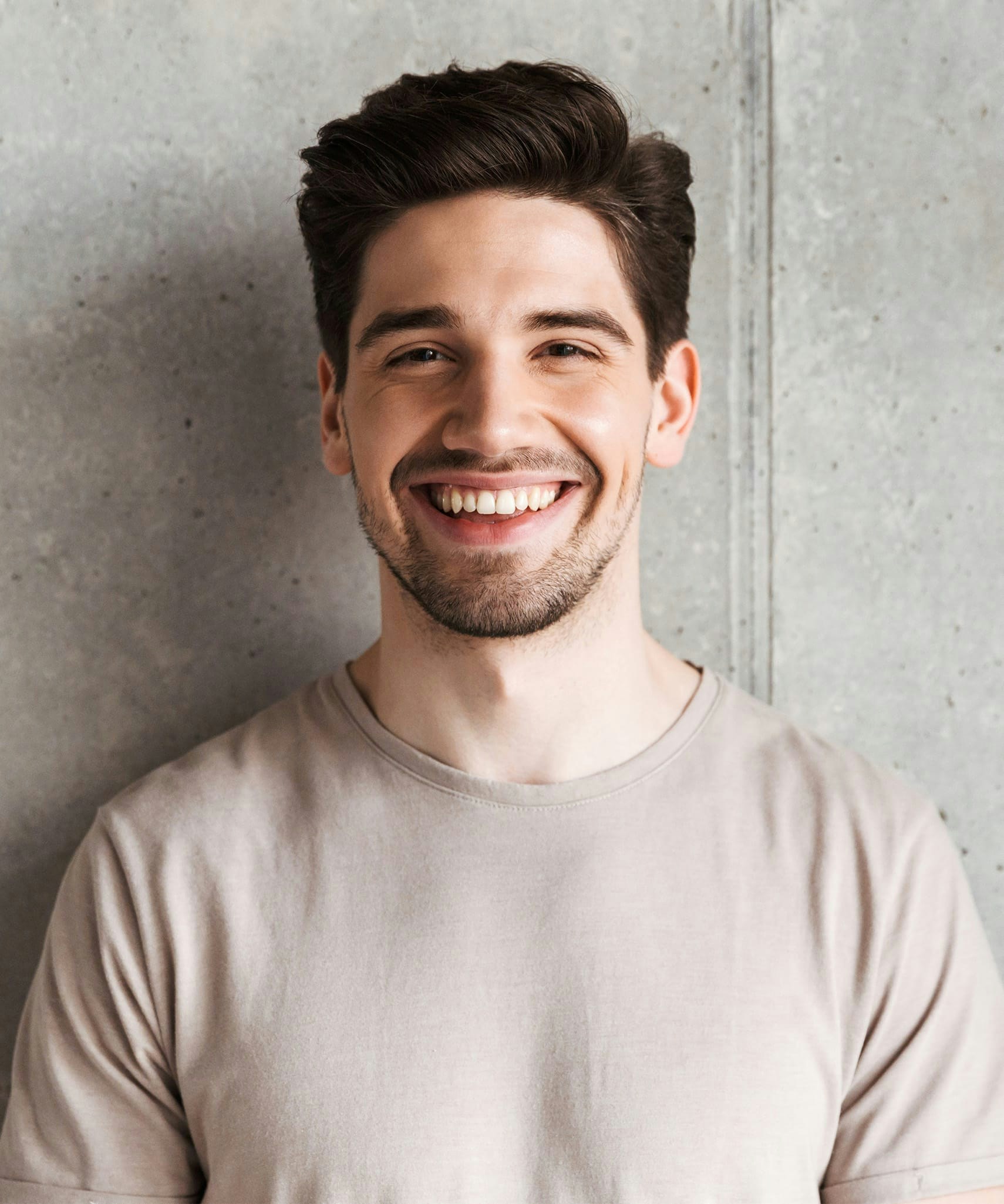 Man with dark brown hair smiling
