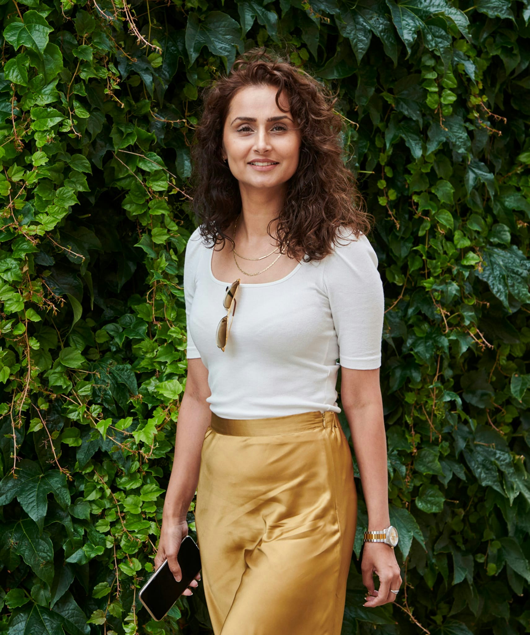 Woman in white top and yellow skirt