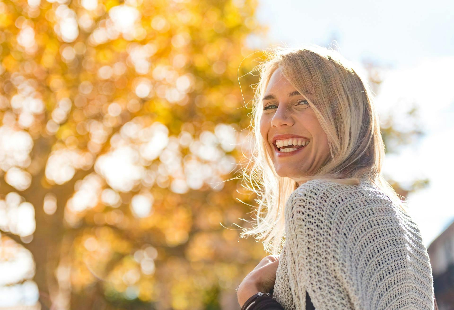Woman with knitted shawl smiling