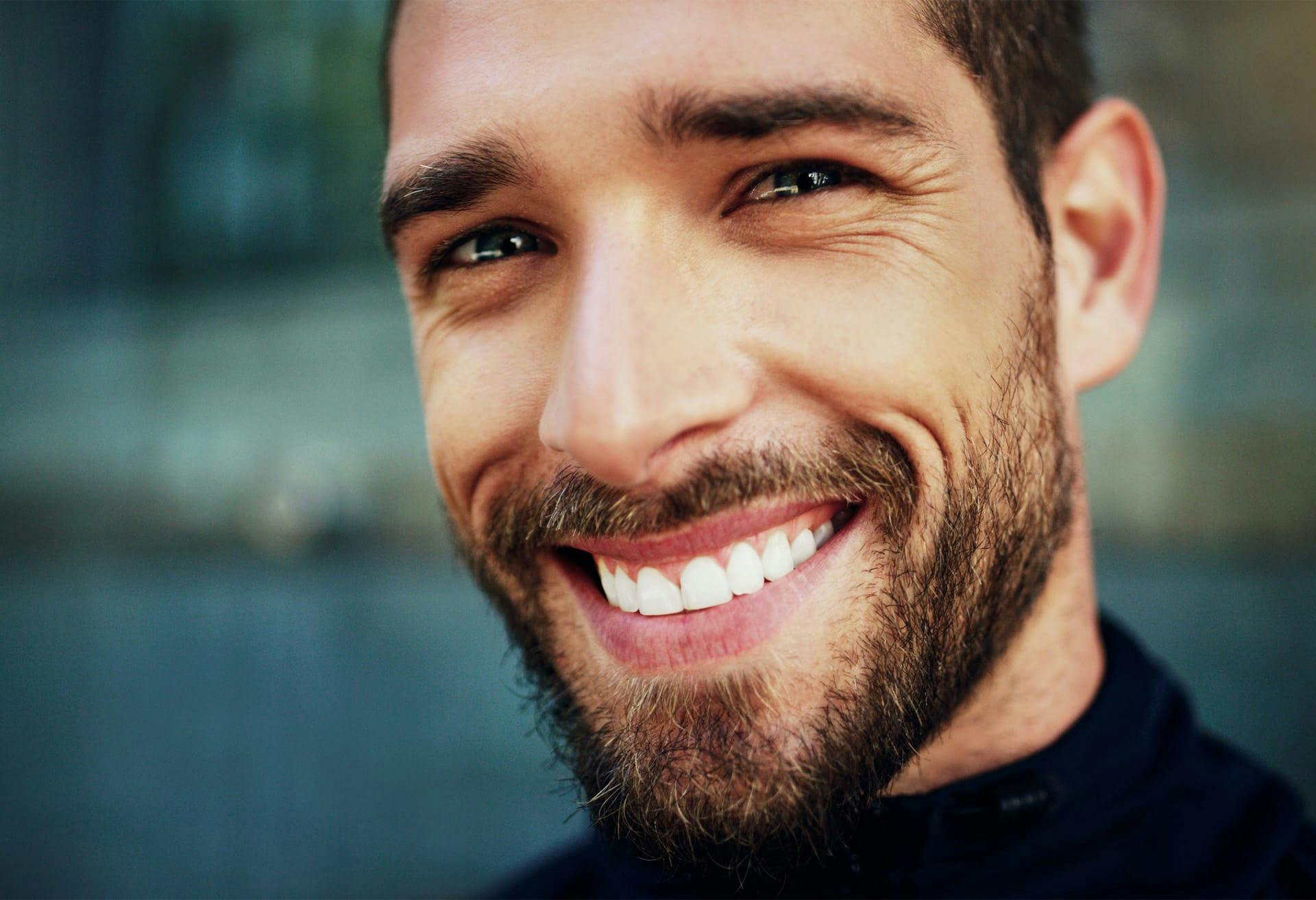 Close up of smiling man.