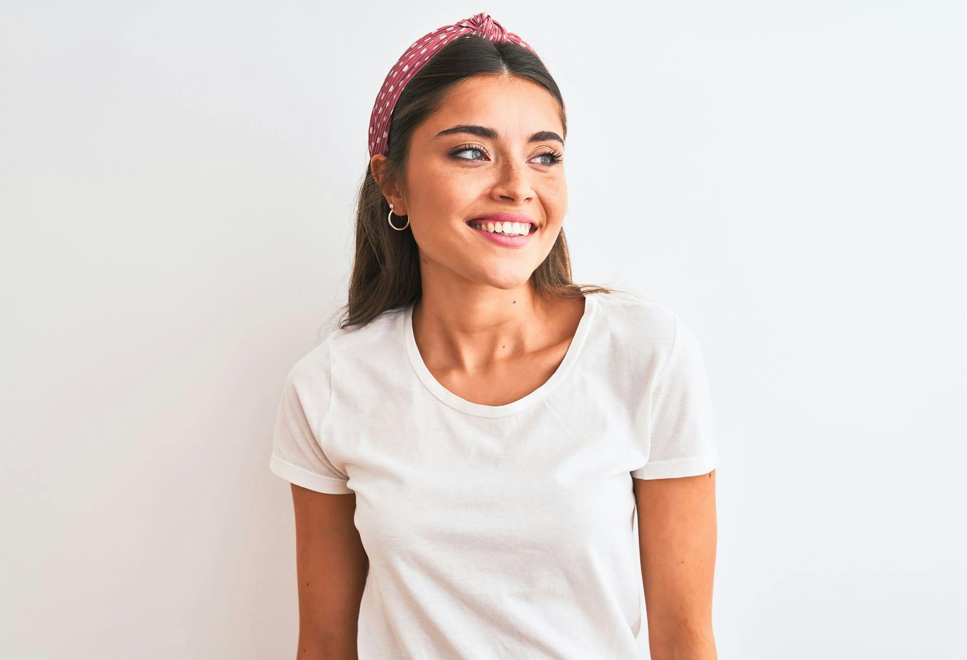 Woman with polka dot headband smiling