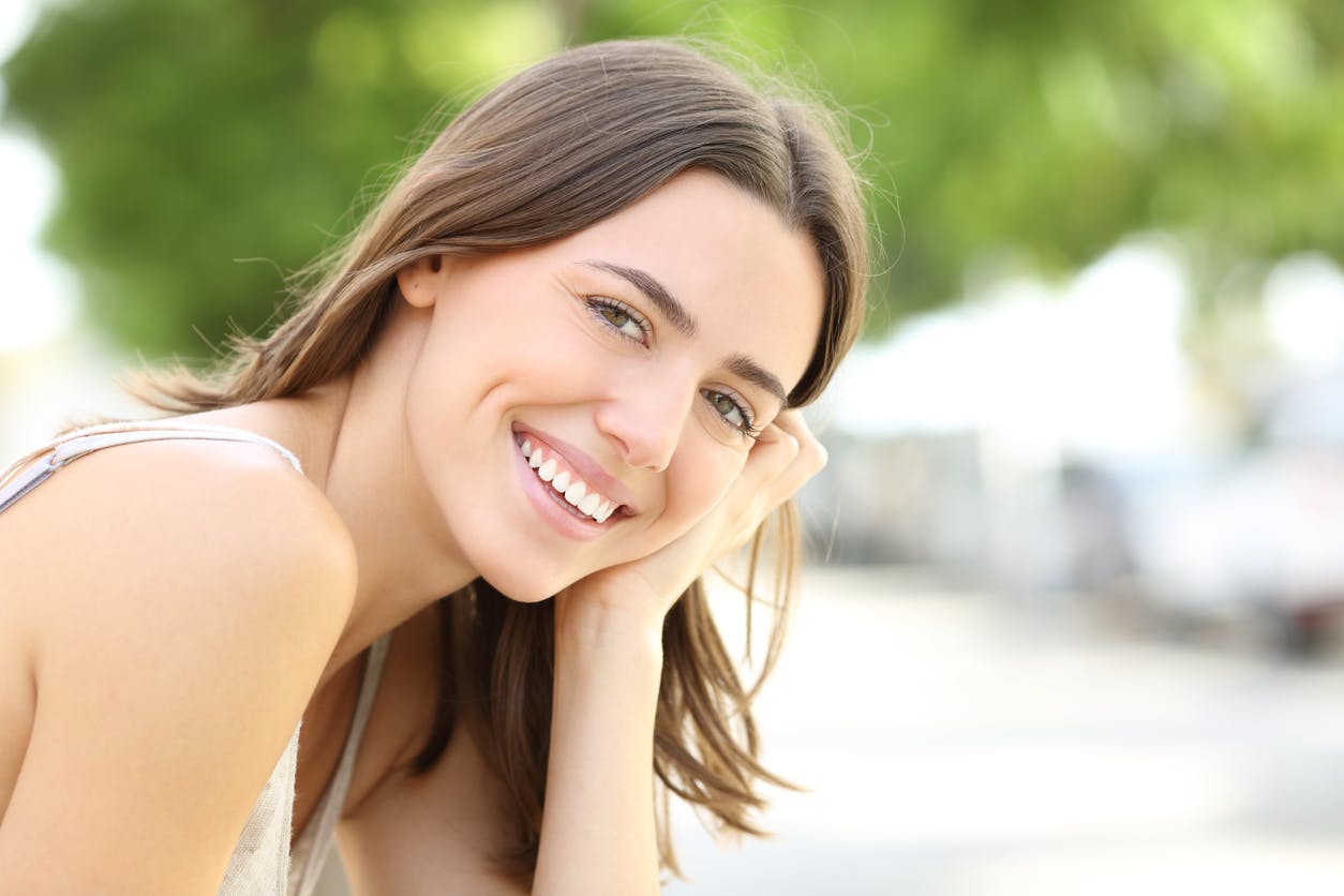 Woman with brown hair smiling