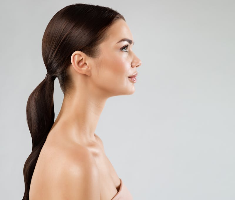 The side profile of a brunette woman