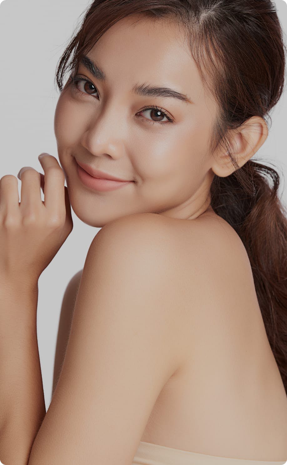 Beautiful woman smiling and tilting her head