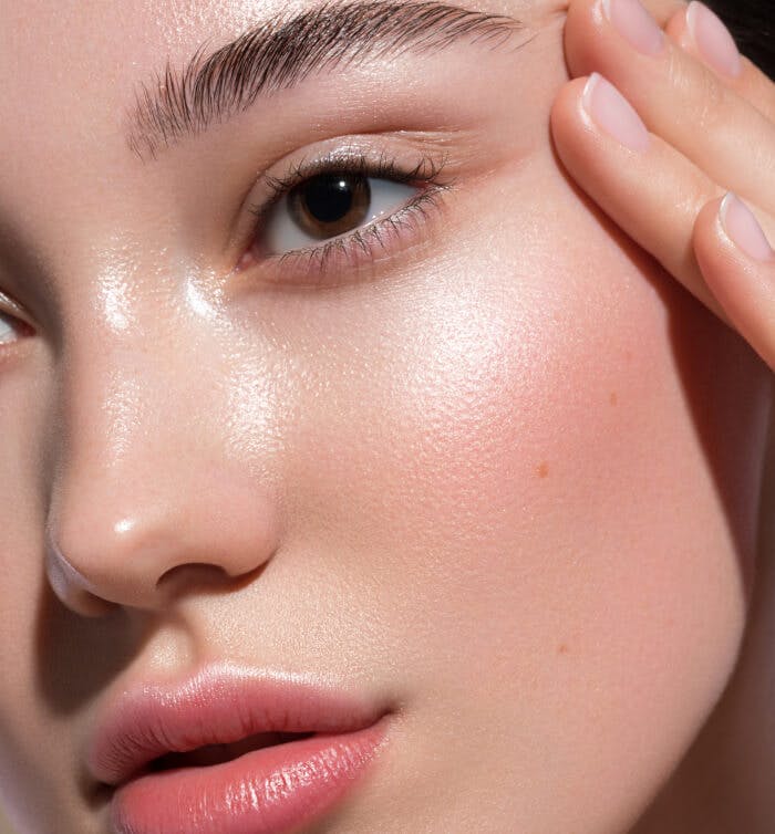 close up image of woman's face with smooth skin