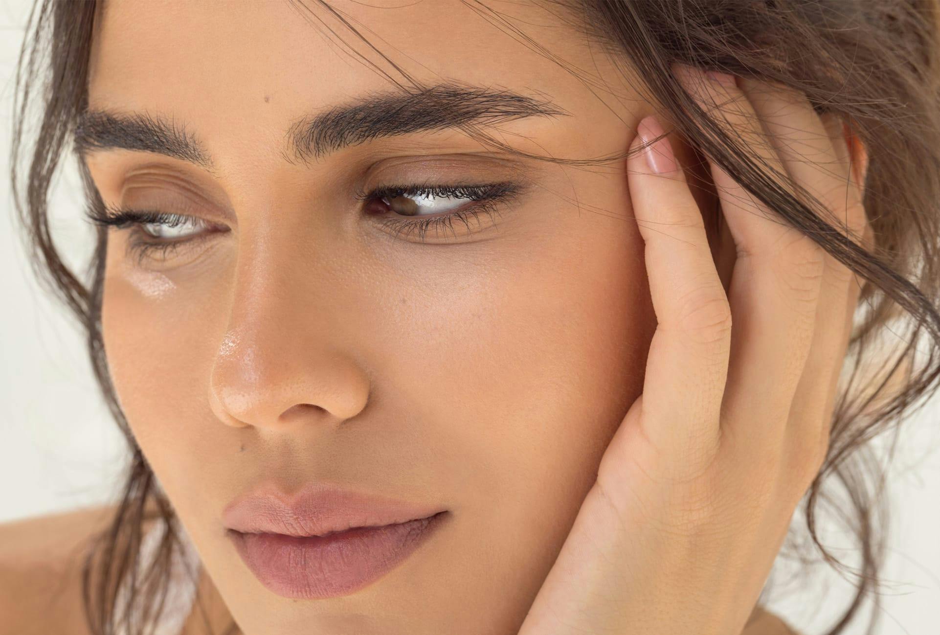 Close up image of woman's face looking to the side