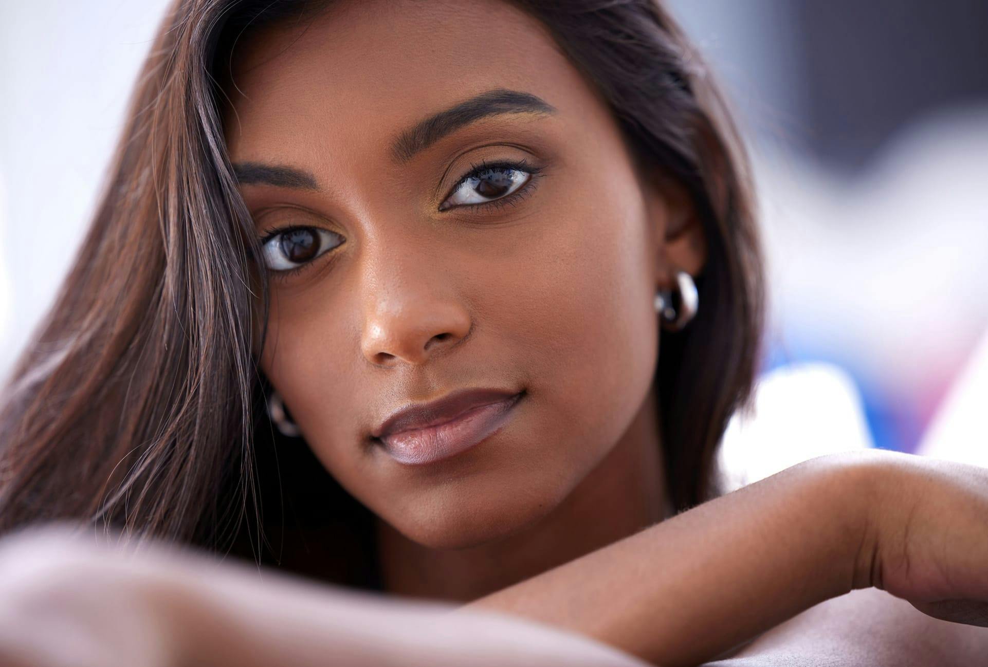 Beautiful brown skinned woman with long dark hair