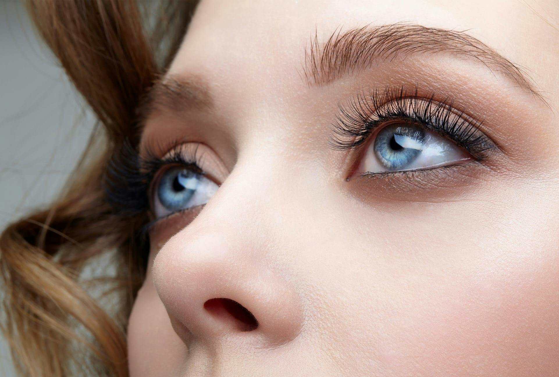 Woman with long eyelashes and blue eyes