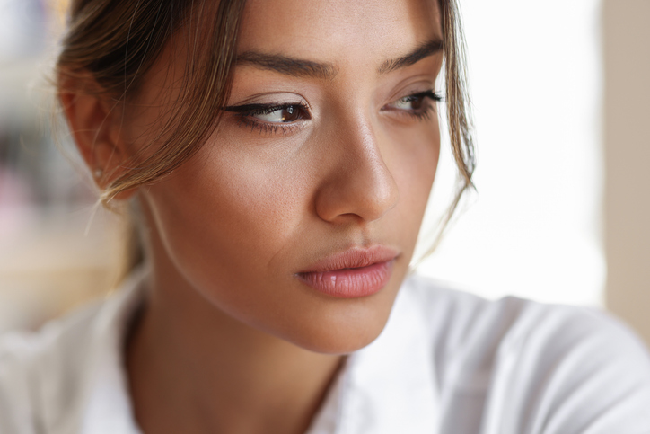 Woman with strong cheek bones looking away