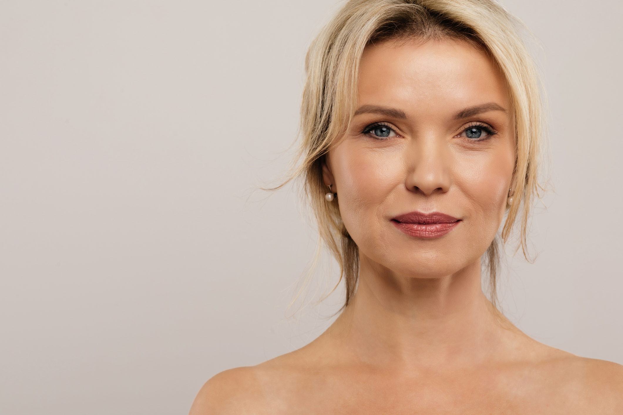 Close-up portrait of a woman with smooth skin