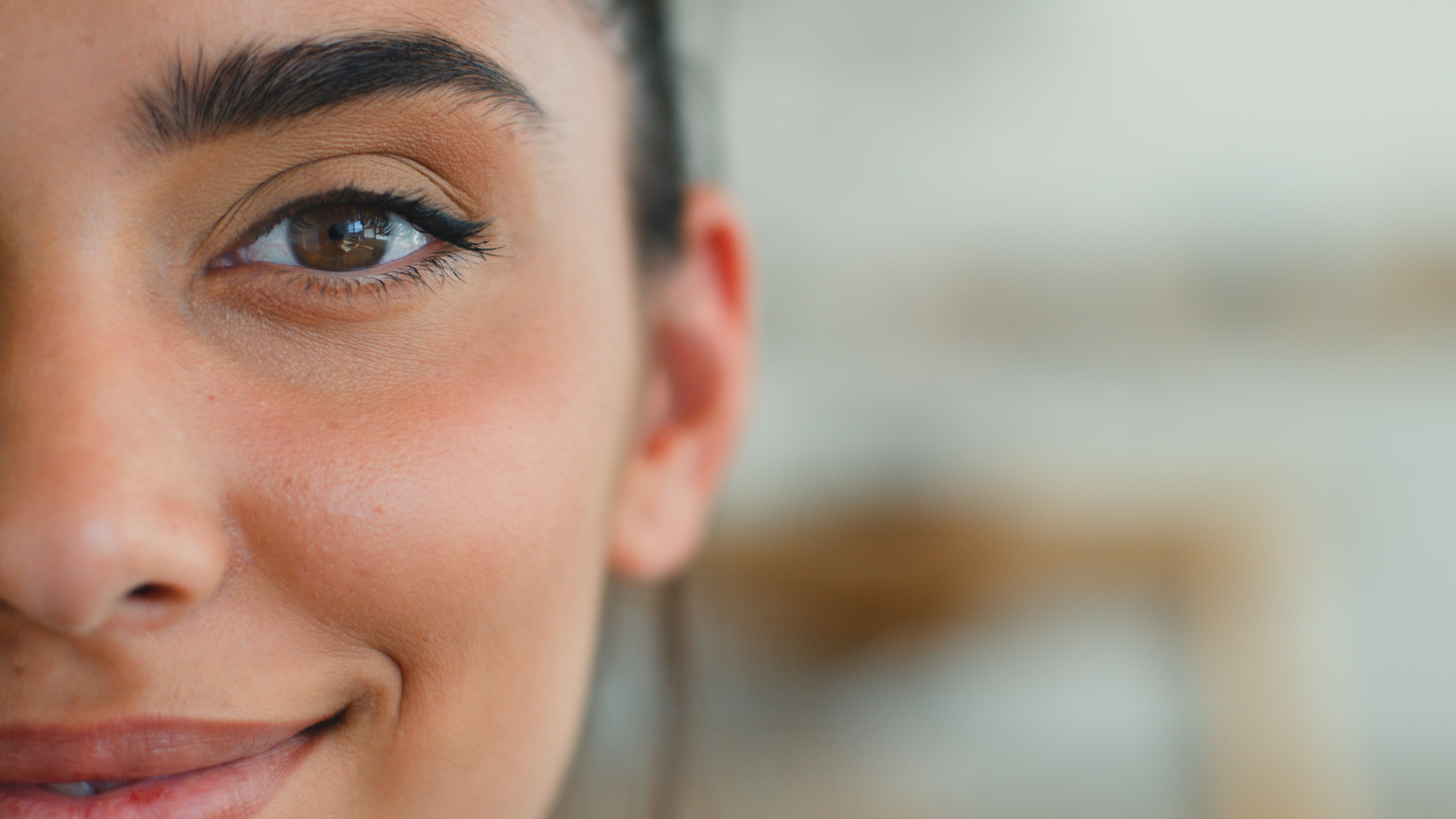 Close-up of half of a woman’s face highlighting the eye and eyelid area