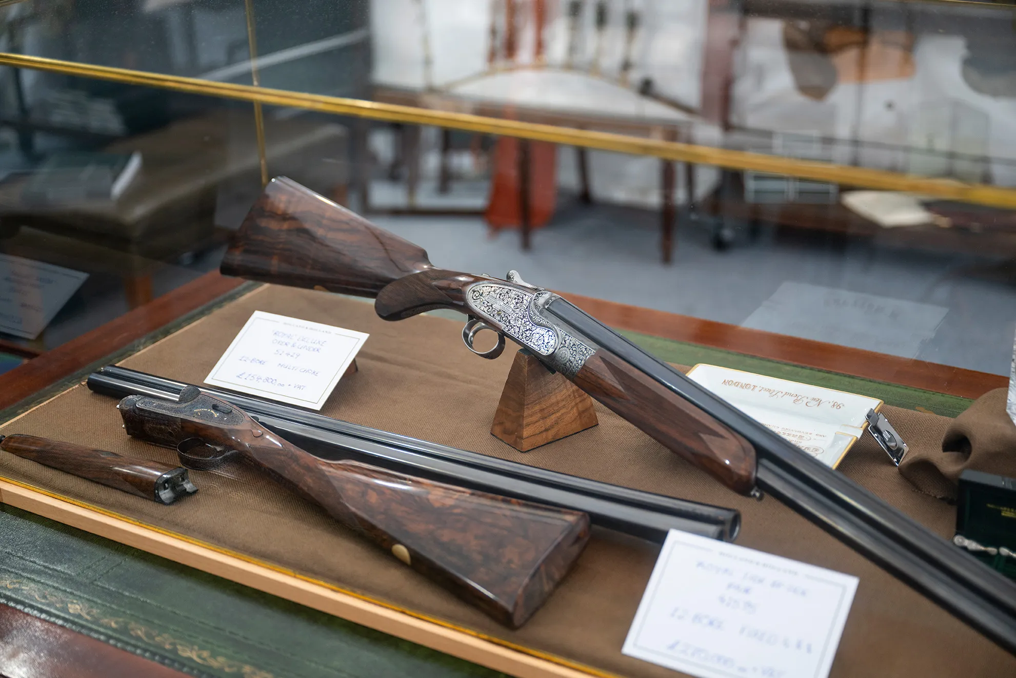 Gun cabnet showcasing Royal over and under shotgun