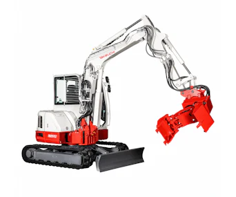 midibagger takeuchi tb257fr schraeg von der seite mit greifer