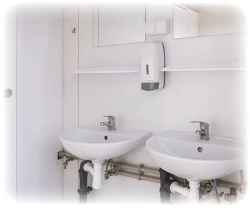 Sanitärcontainer MW23 von Mobilbox von innen mit Waschbecken