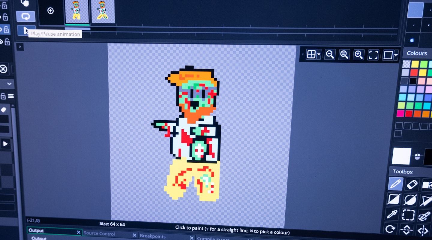 Computerbildschirm mit verpixelter Figur in Programm