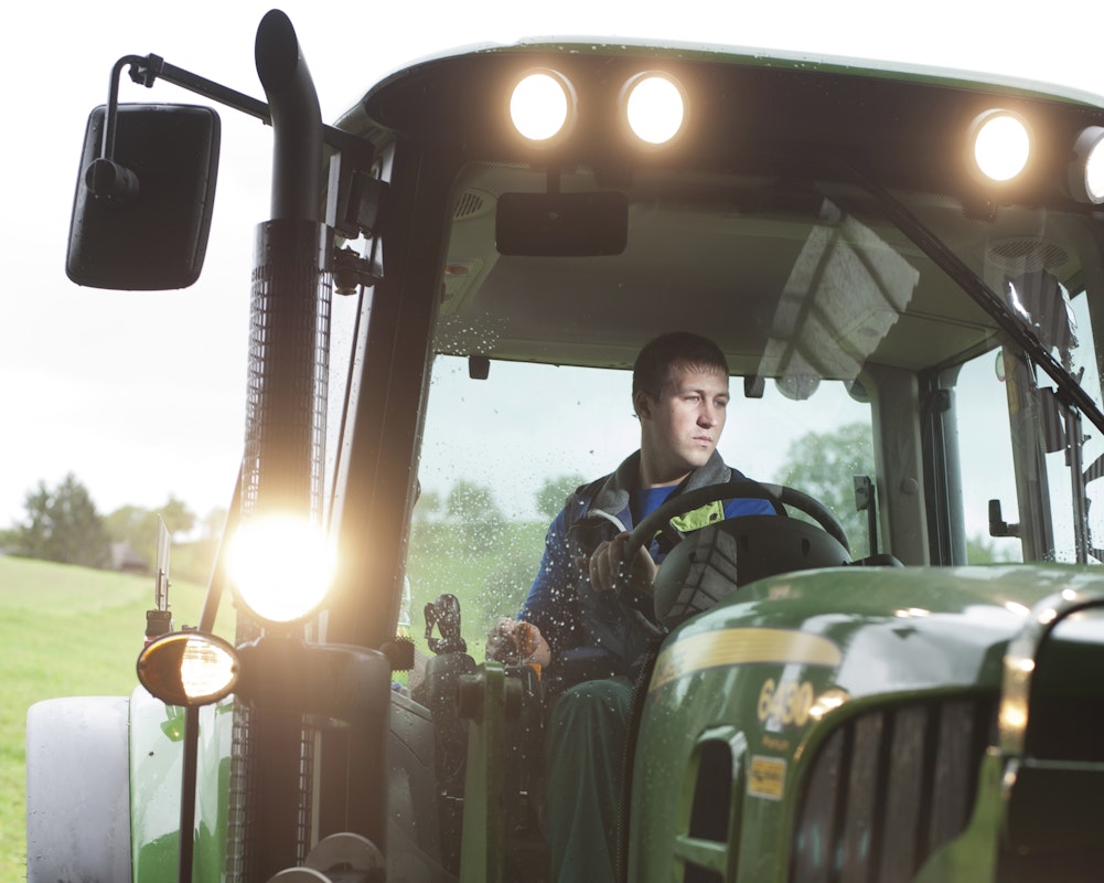 Fotografie Mann auf Traktor