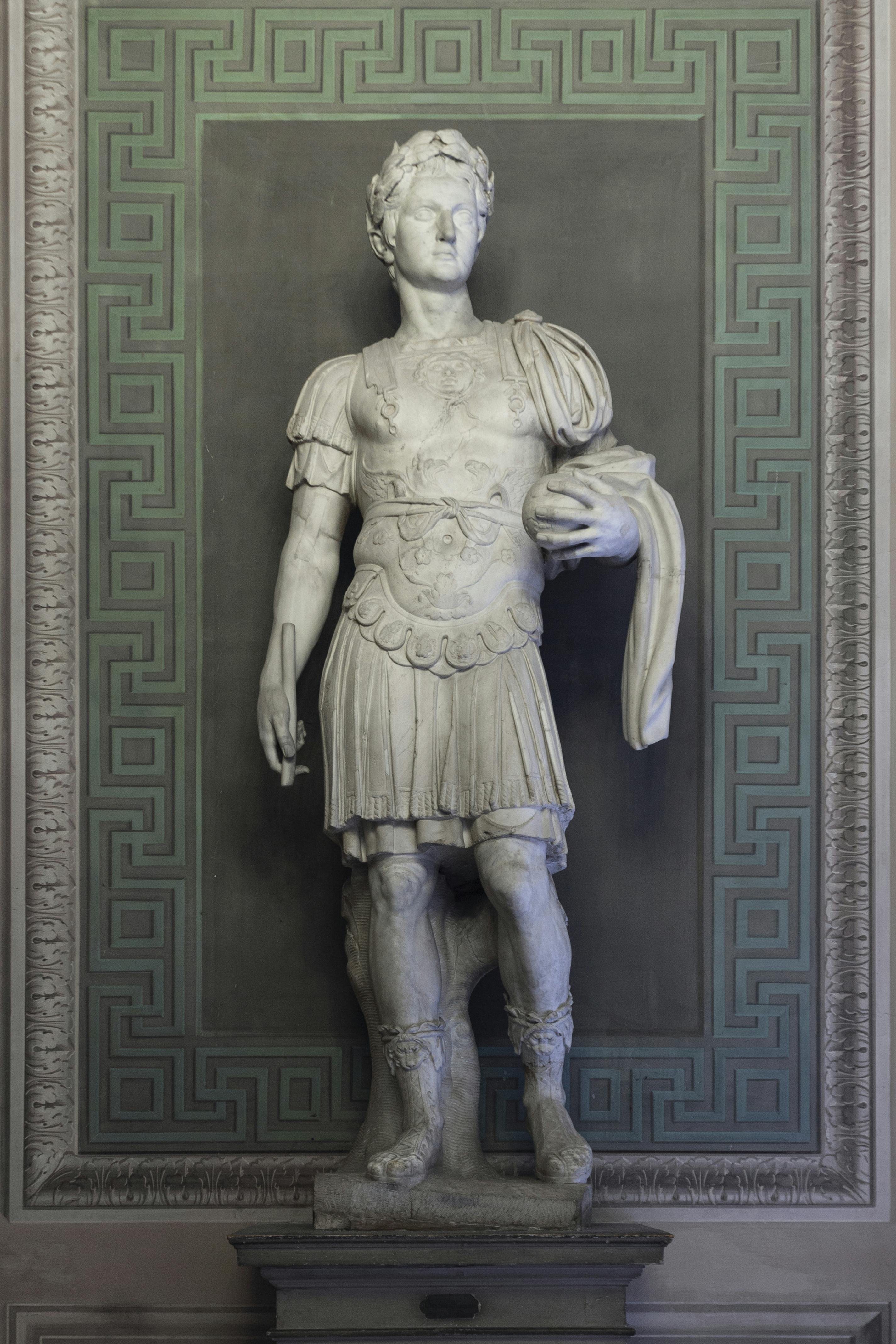 A statue of a Roman holding the busts of his ancestors, the so