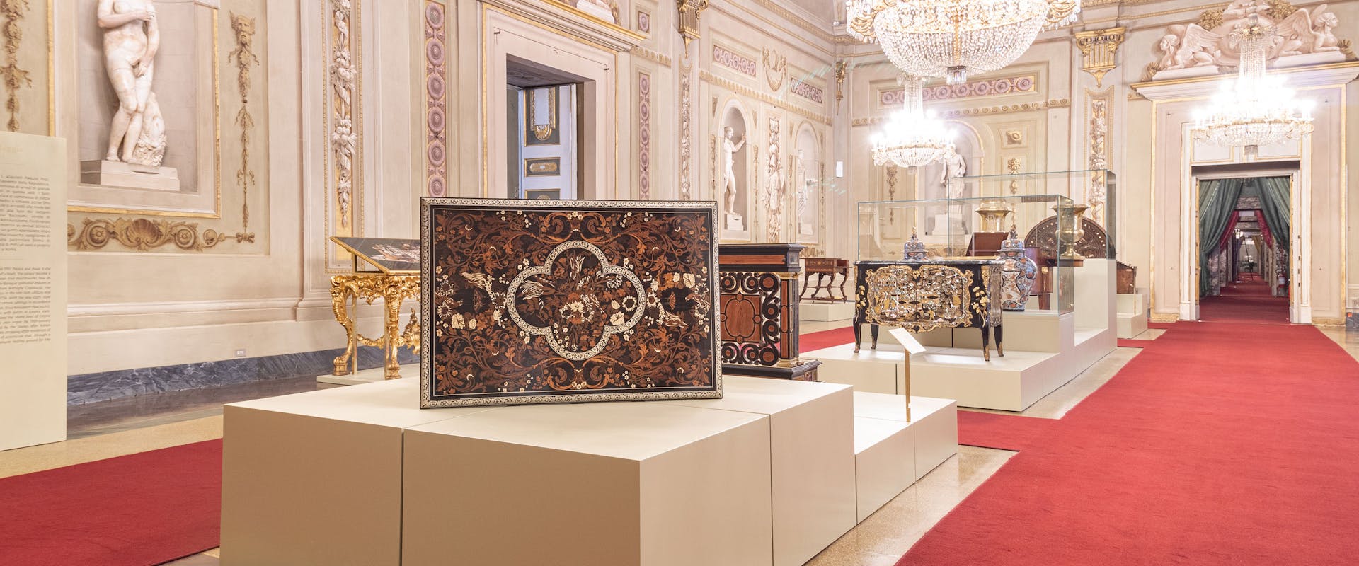The Hall of Niches in Palazzo Pitti with an exhibition of furniture The Hall of Niches in Palazzo Pitti with an exhibition of furniture