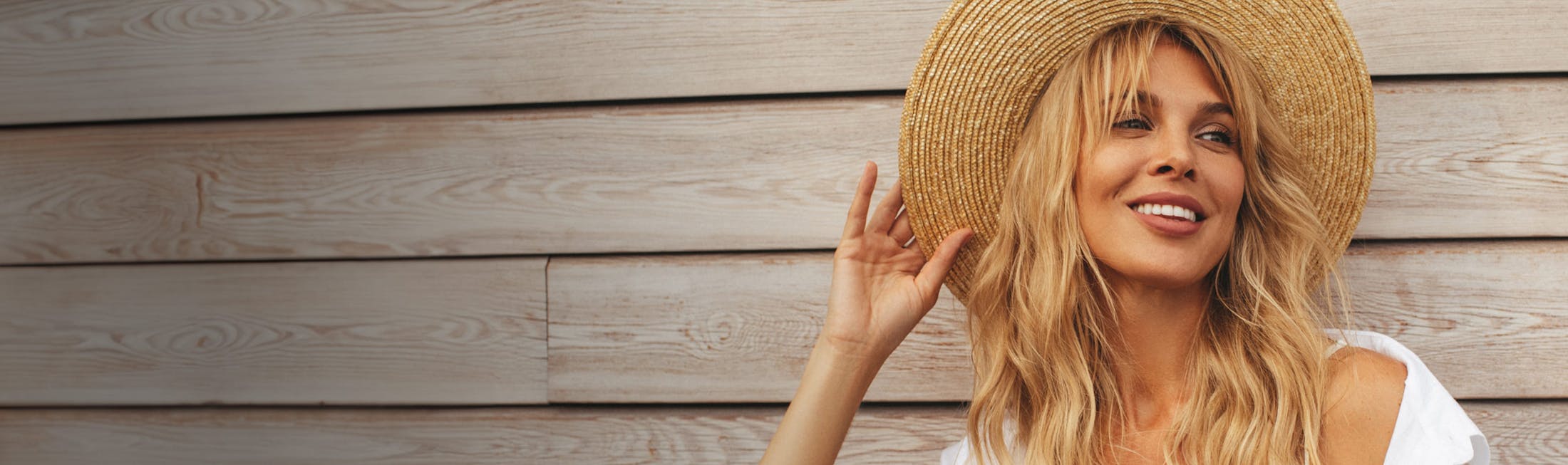 Woman in a sun hat smiling