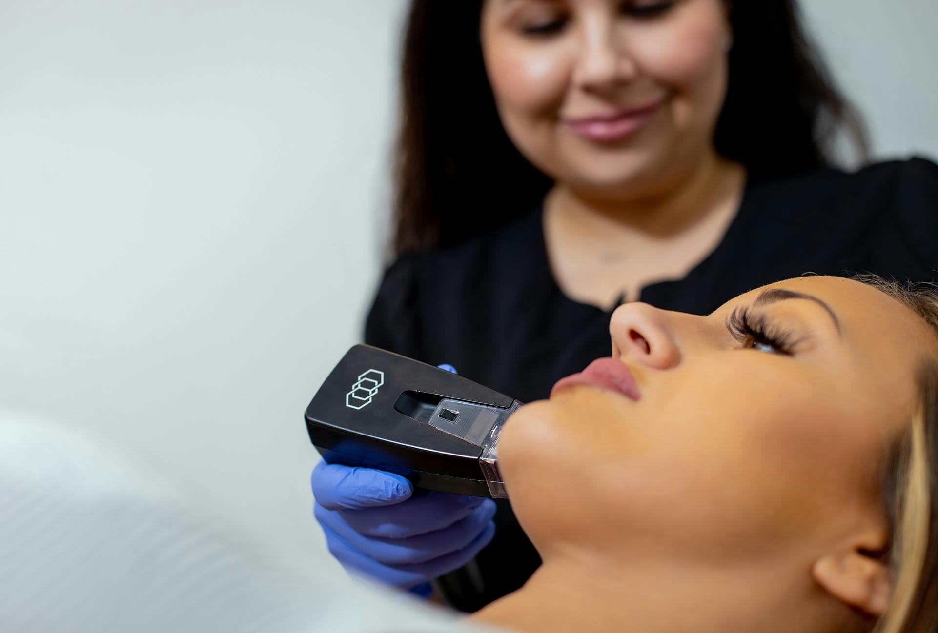 Woman getting a treatment while lying down