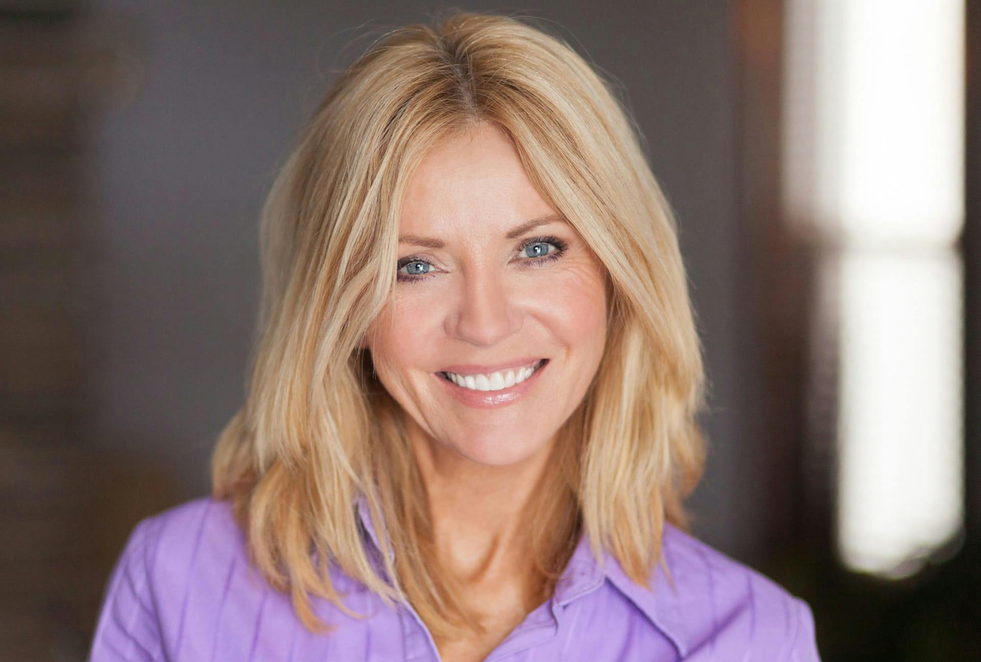 Woman in a purple top smiling