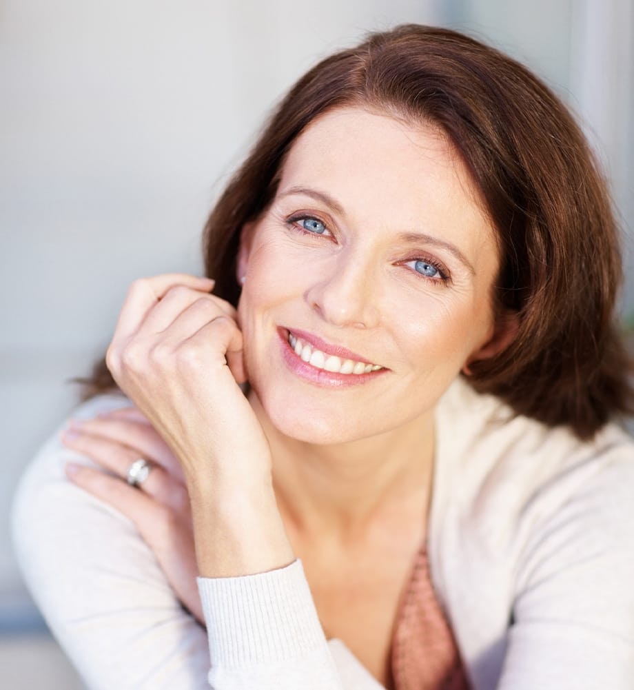 Woman in a long sleeve white top