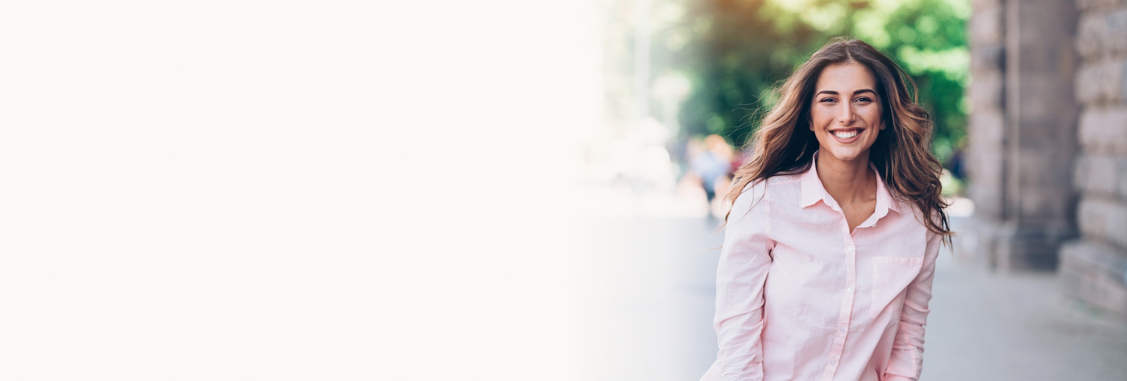 Woman in a pink button up shirt
