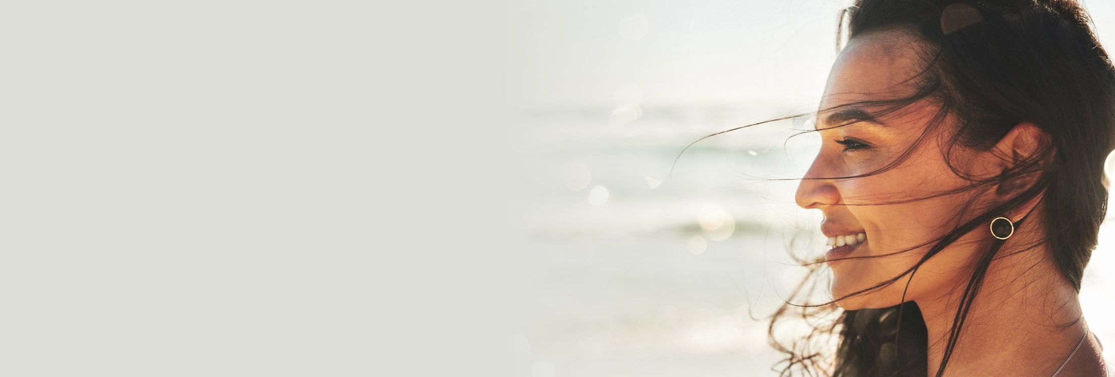 Woman standing by the ocean