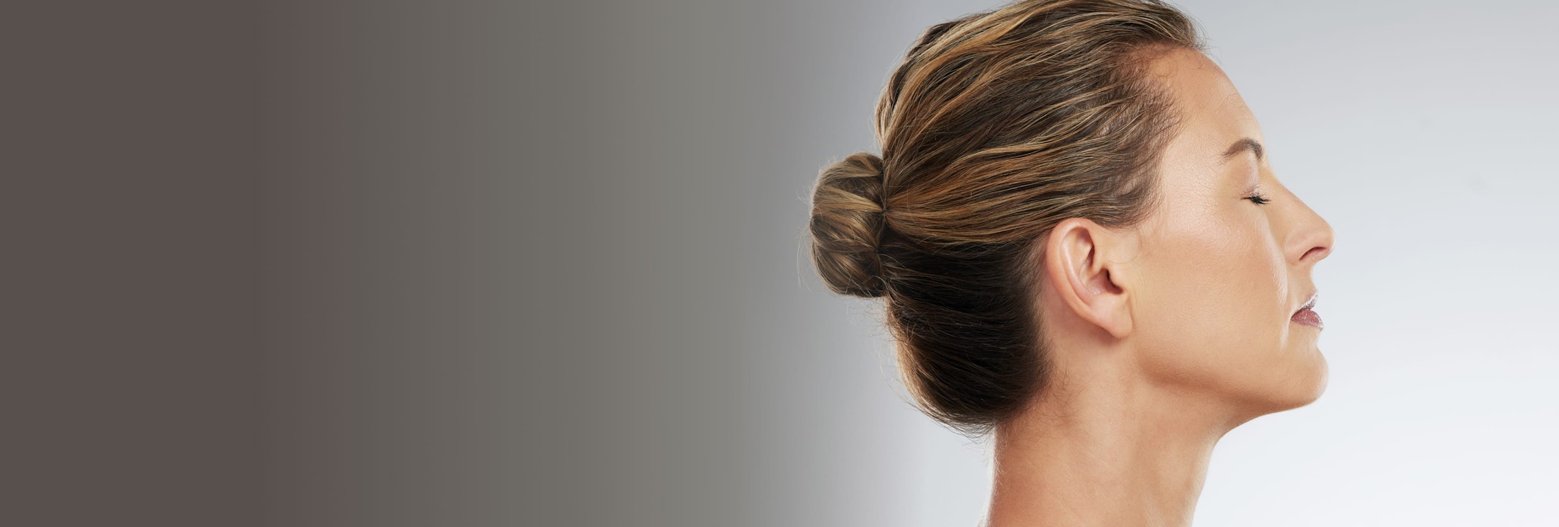 woman with her hair in a bun