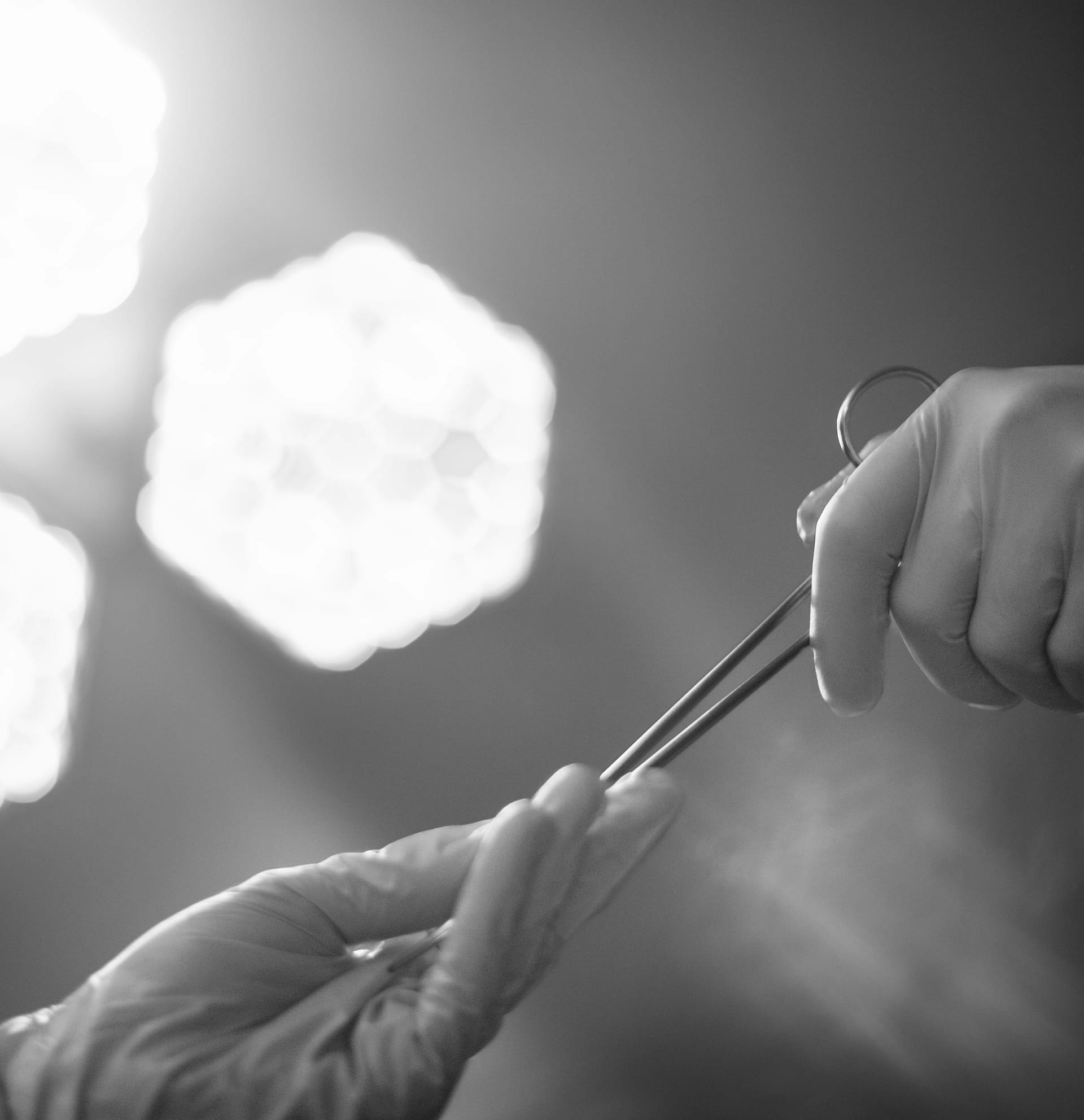 doctor grabbing scissors