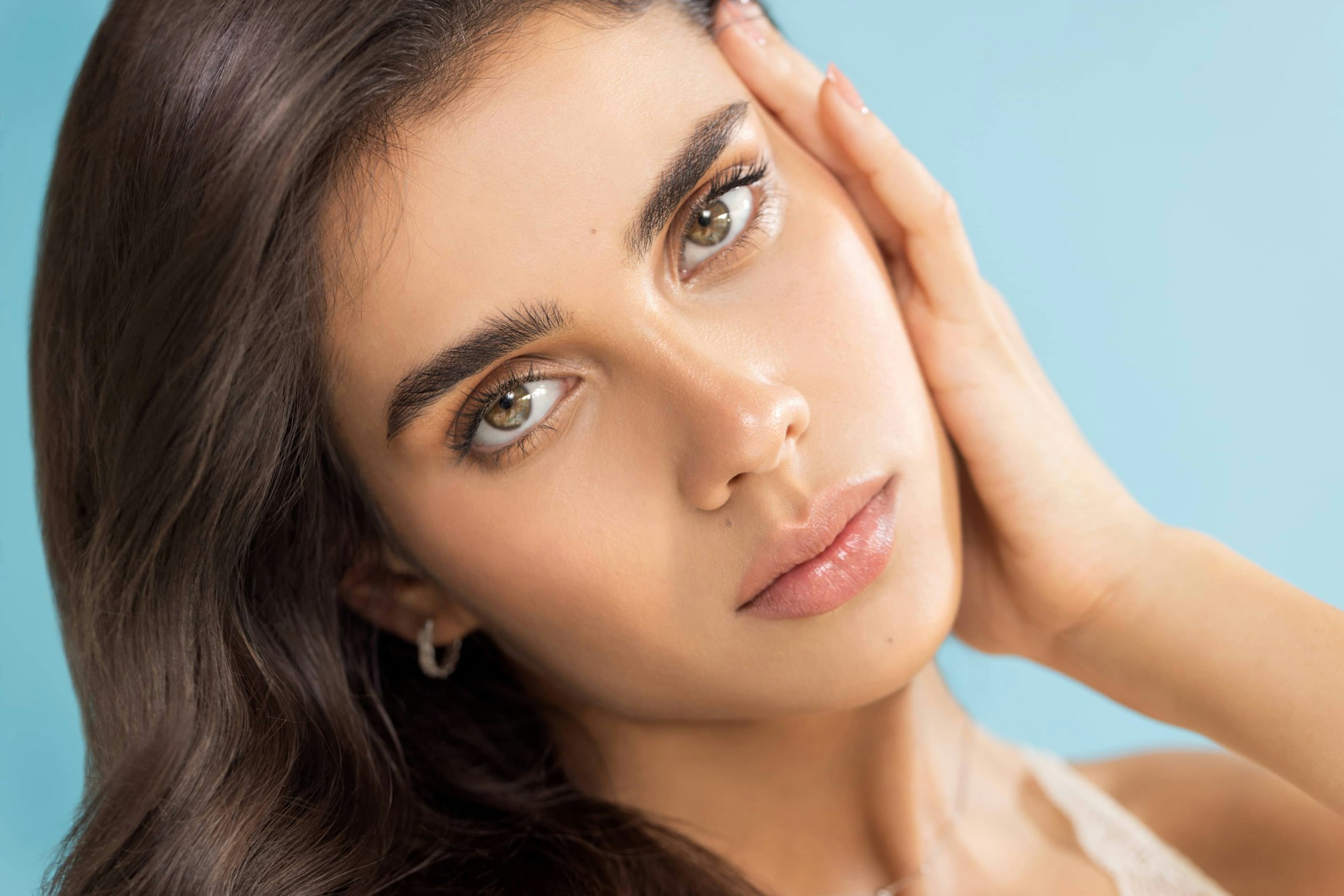 Woman who received facial plastic surgery on her eyes and brows