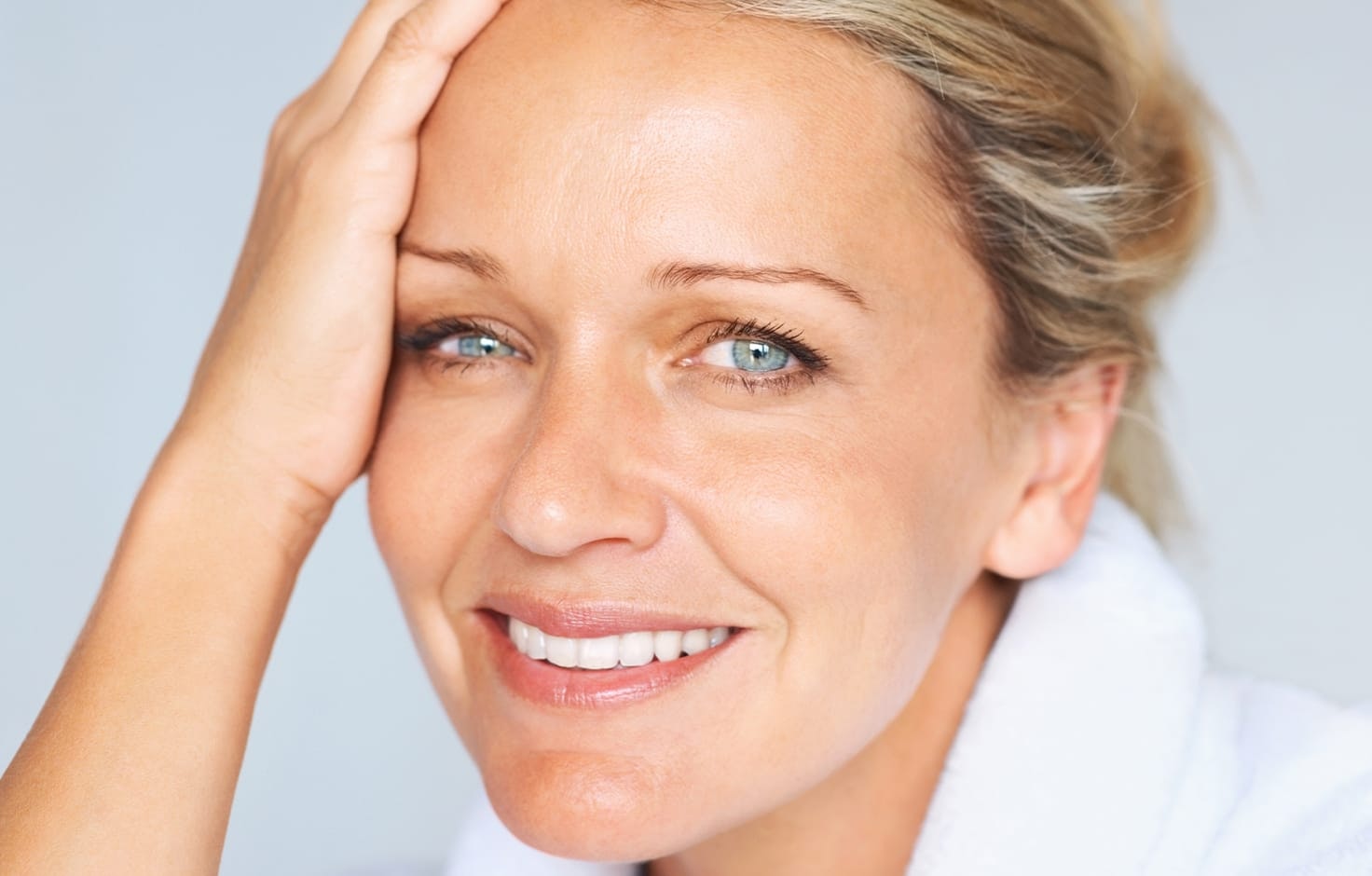 Woman resting her face in her hand