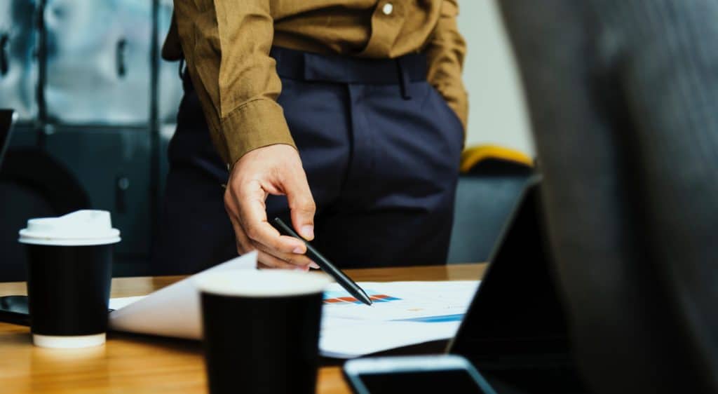 Man with pen planning lead management