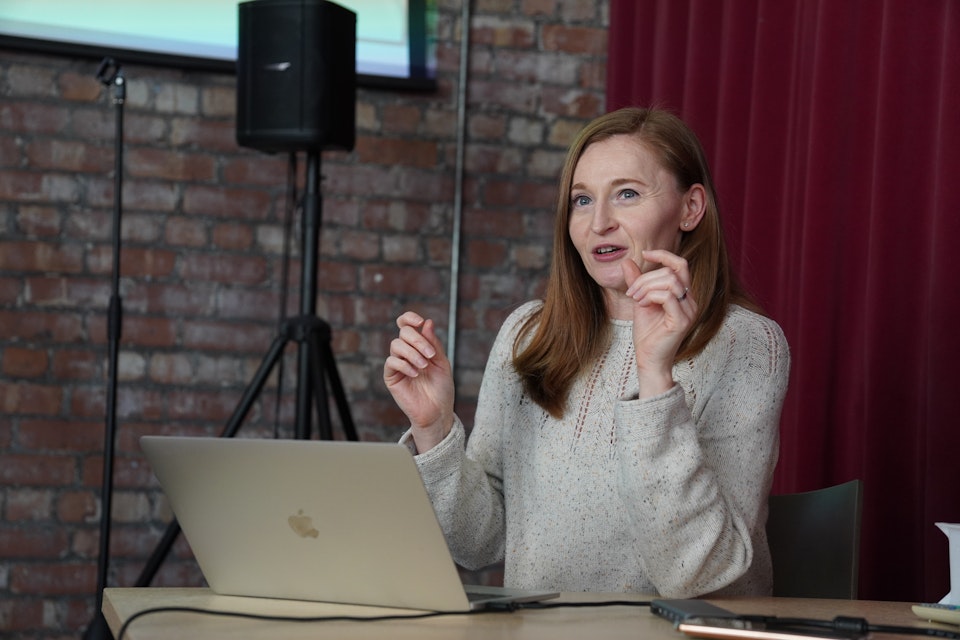 Triana HubSpot consultant talking in front of laptop