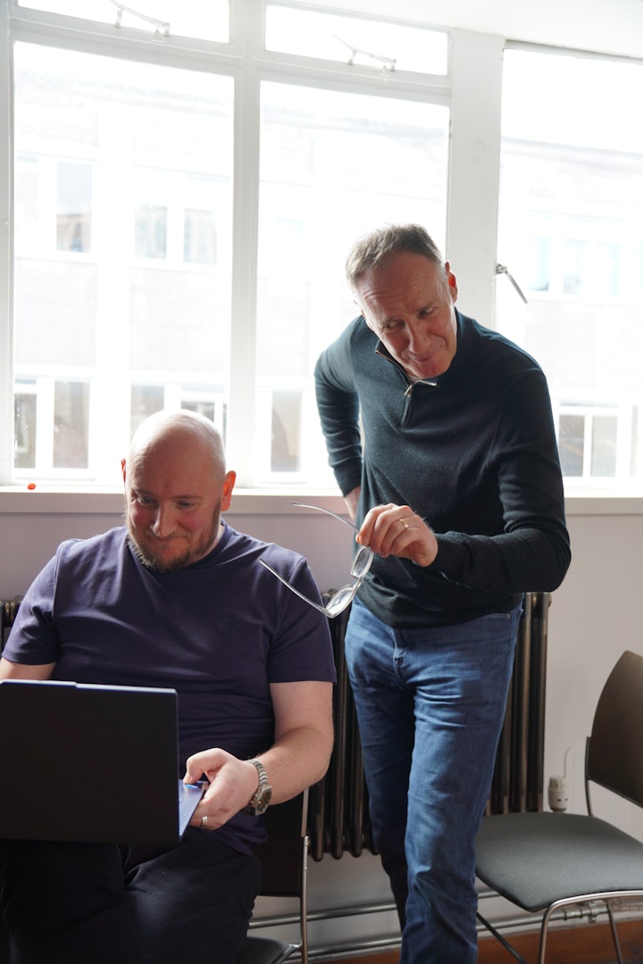 Rob and Mark pointing to laptop screen