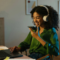 Woman calling behind laptop