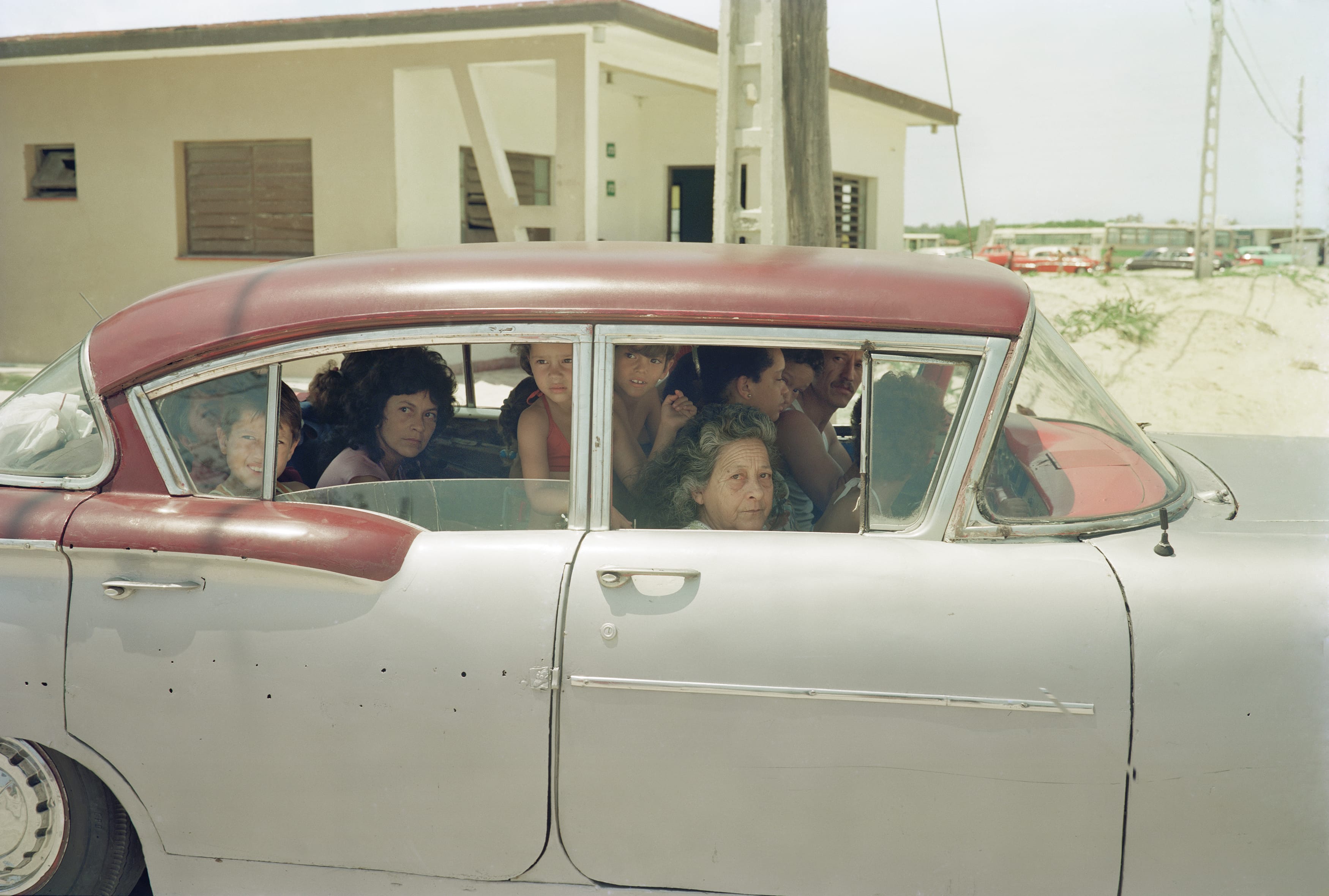 A Sunday afternoon drive to Santa Maria del Mar beach, outside of Havana. There are at least 12 people in the car. Taken on my first trip to the country.