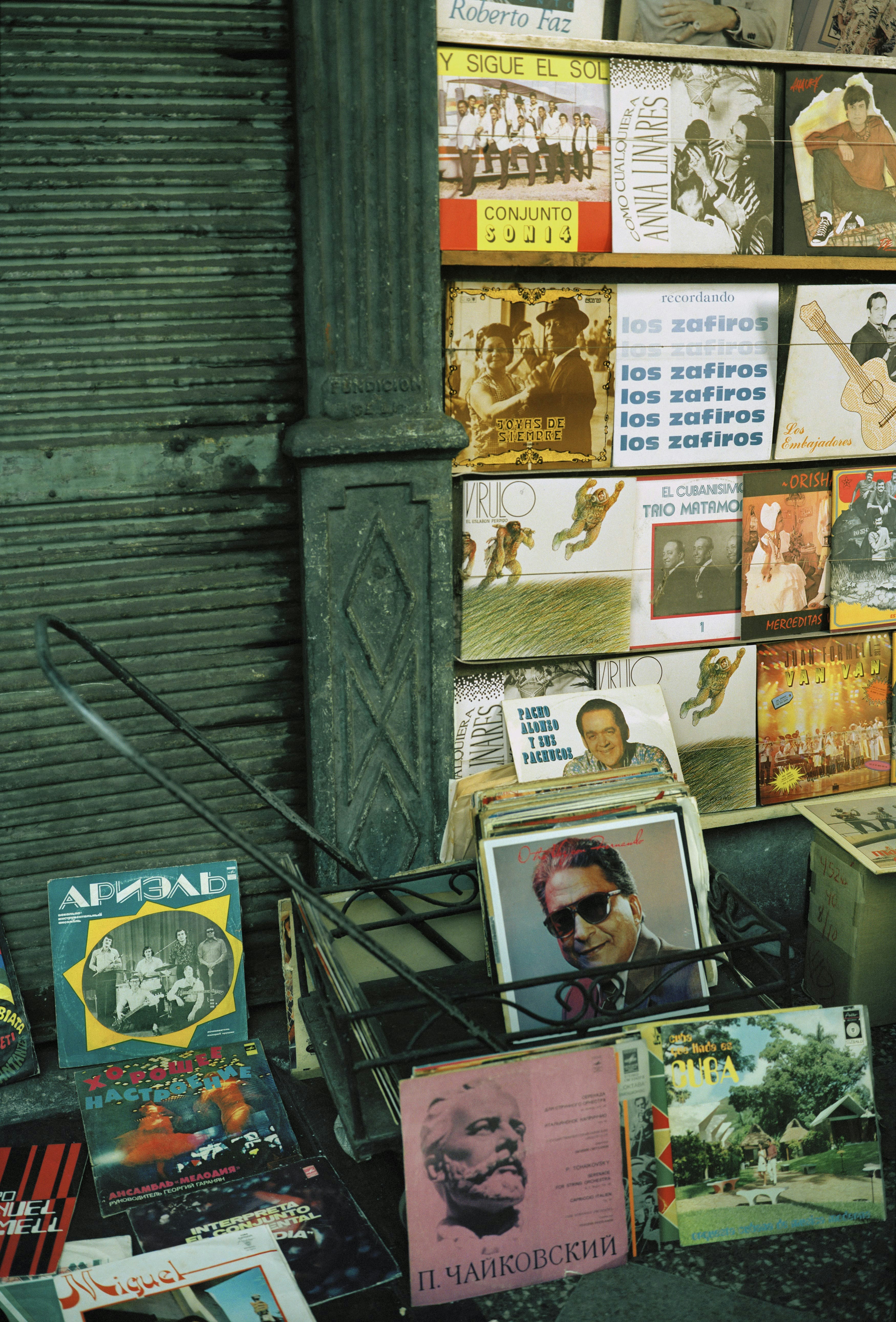 The sale of personal items such as records and books was a common sight on the streets of Havana during the 1990s “ Special Period.”. A wide variety of musical genres — Russian, Pop (Los Van Van) Son, Cuban country music from the 40s and on (Los Trio Matamores) and African religion Yoruba-inspired (Orisha) are on display here.