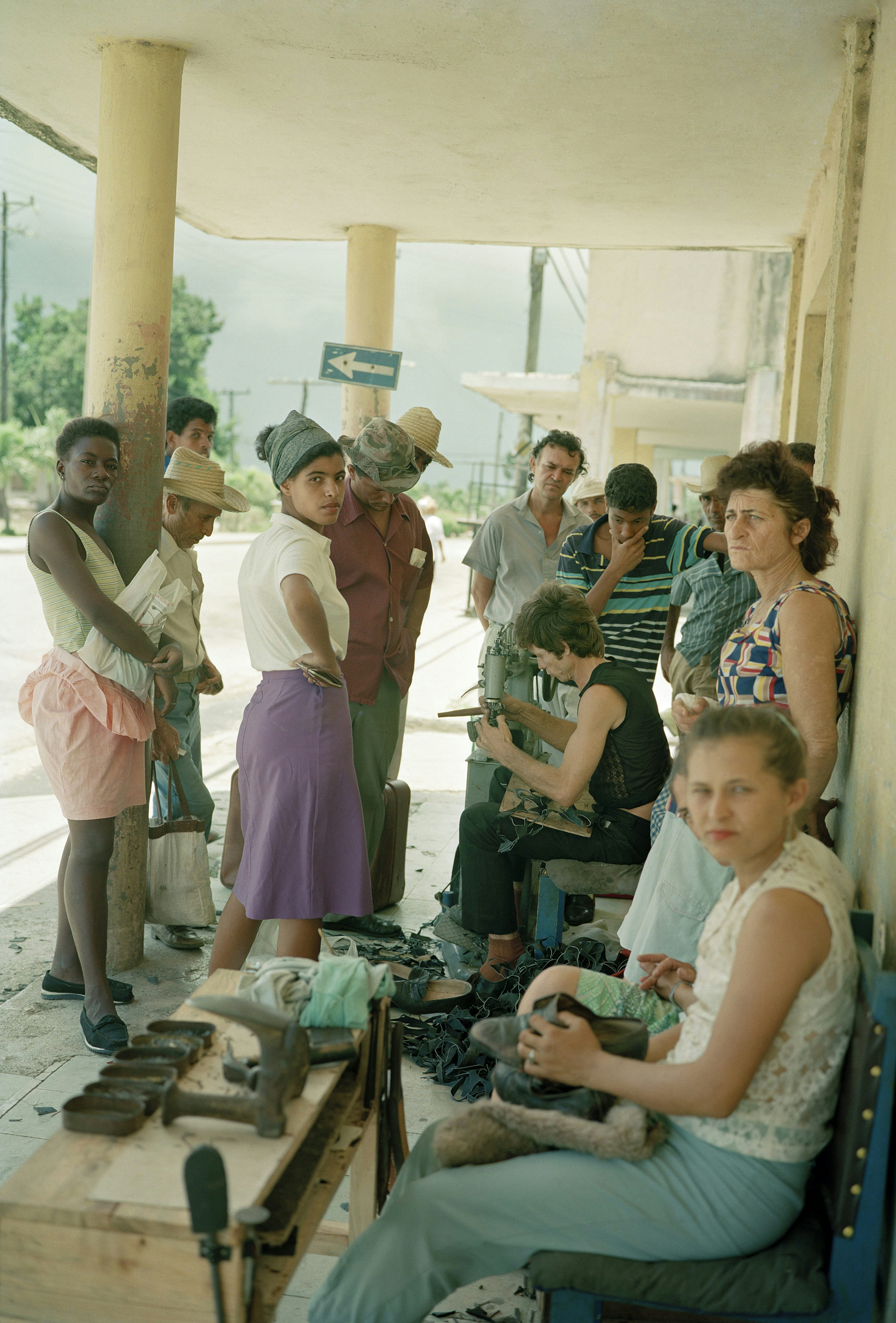 People wait in line for an outdoor shoe repair in the town of Cueto in the Holguin province. Taken on one of several cross-country trips to explore every major city and town on the 875-mile-long island.