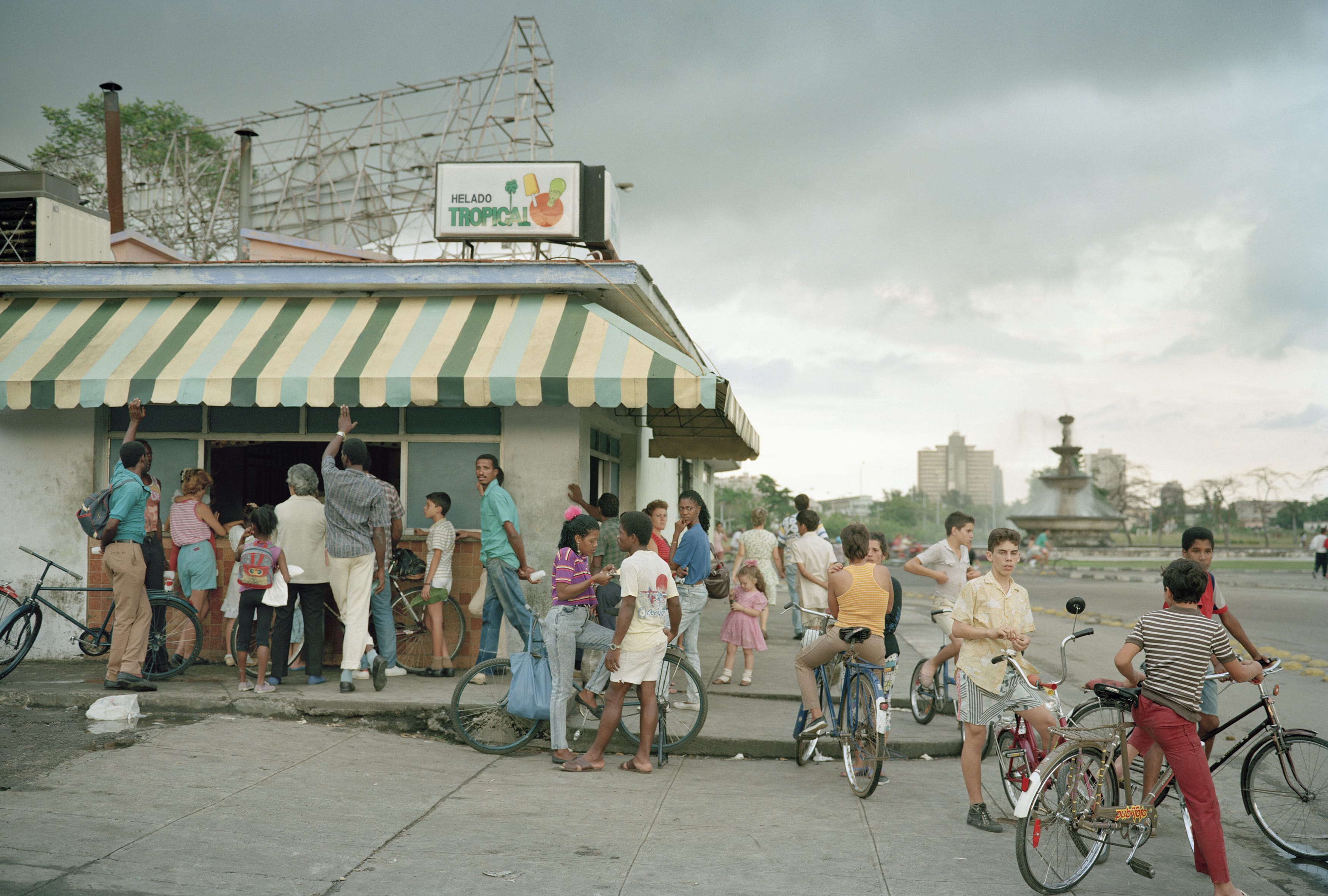 People wait in line to buy ice cream in Havana. Bicycles imported from China were one of the main forms of transportation at the time.