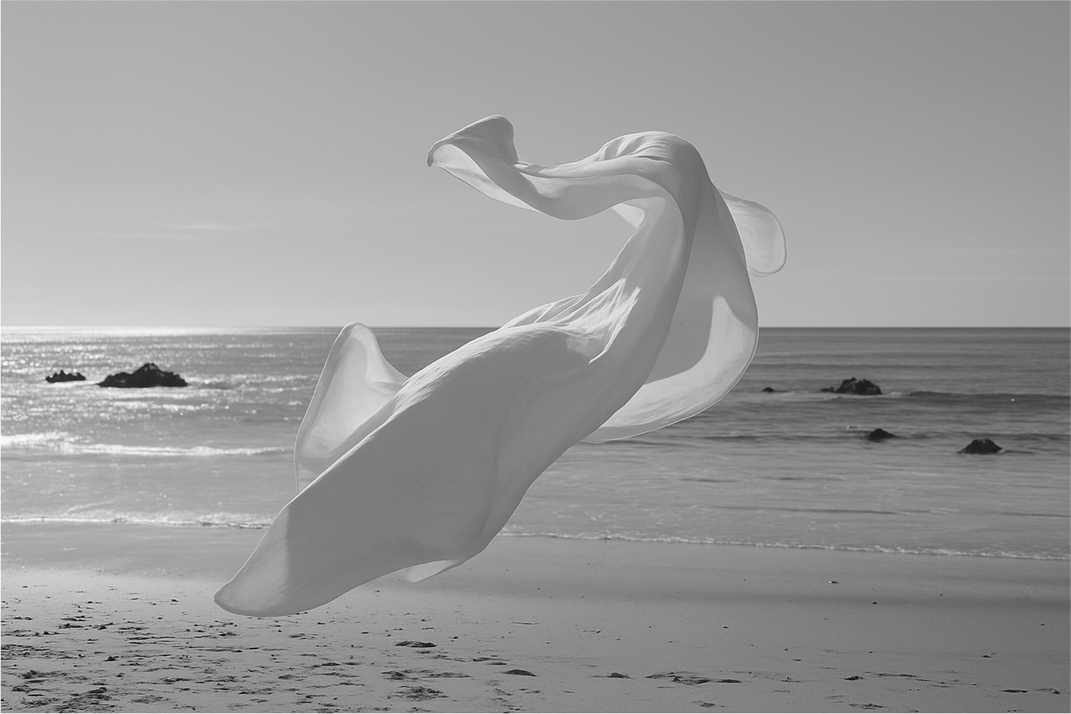 Sheet of fabric flying on the wind at the beach