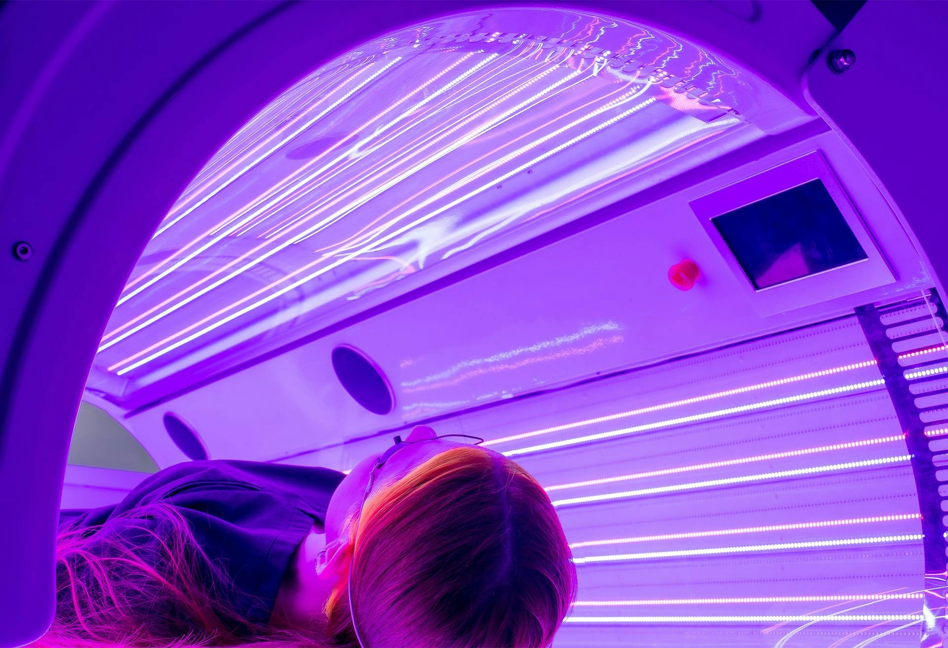 Woman in a UV bed